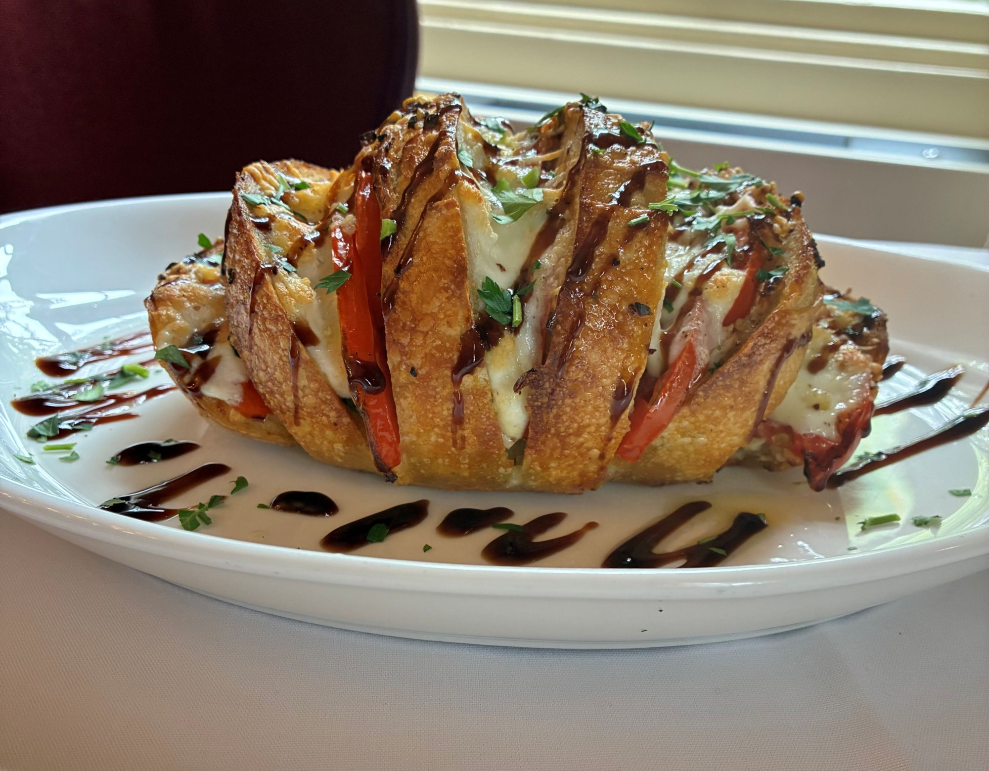 Caprese Stuffed Sourdough Bread tomato | mozzarella | basil | garlic oil | balsamic 